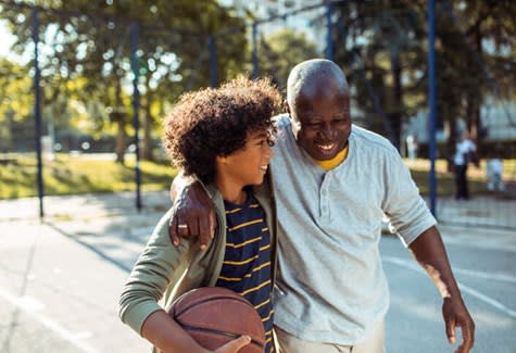 Man Playing Basketball With Grandson