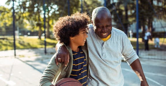 Man Playing Basketball With Grandson