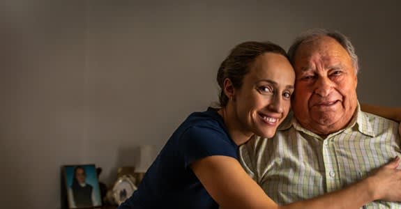 Smiling man and his adult daughter