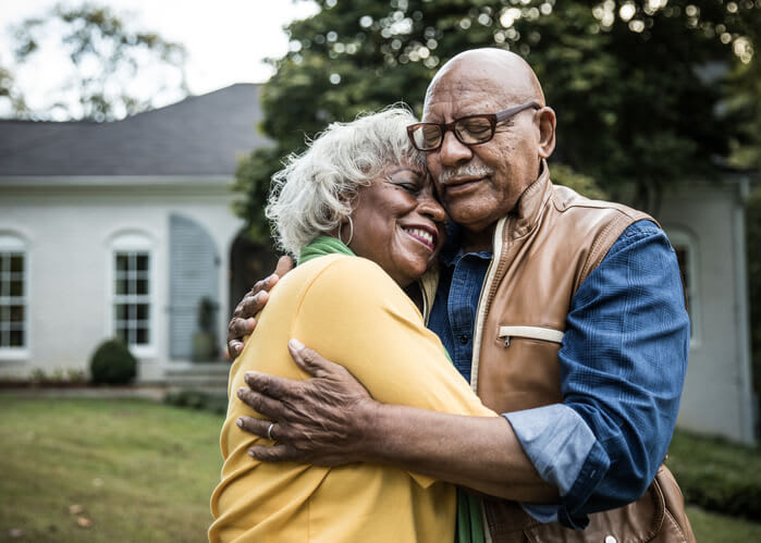 Happy Couple Embrace Outside