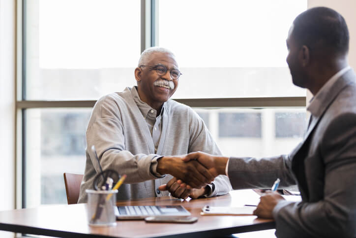 Man Meets With Insurance Counselor