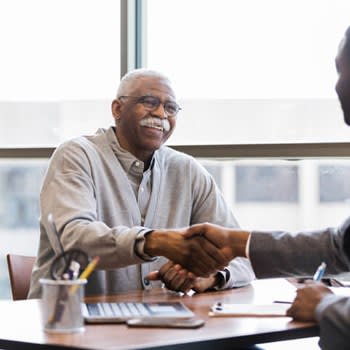 Man Meets With Insurance Counselor