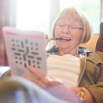 Woman doing crossword puzzle