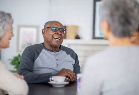Man Having Tea With Friends