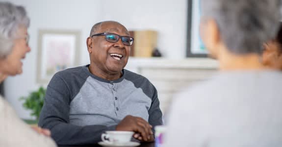 Man Having Tea With Friends