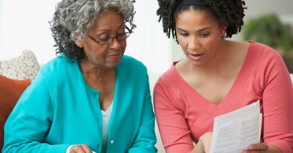 Woman helps her mother review documents