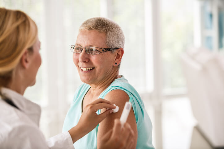 Woman gets prepared for vaccination