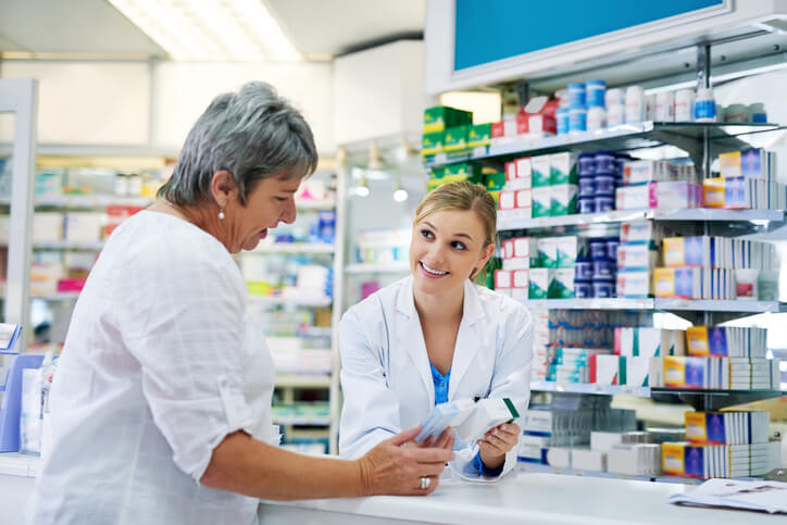 Woman gets help at pharmacy