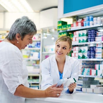 Woman gets help at pharmacy