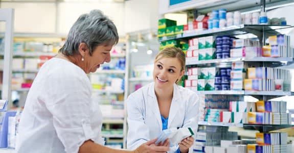 Woman gets help at pharmacy