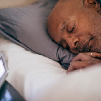 Man sleeps soundly in bed