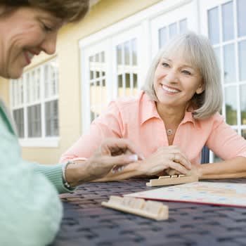 Ladies playing Scrabble