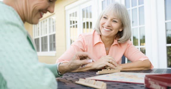 Ladies playing Scrabble