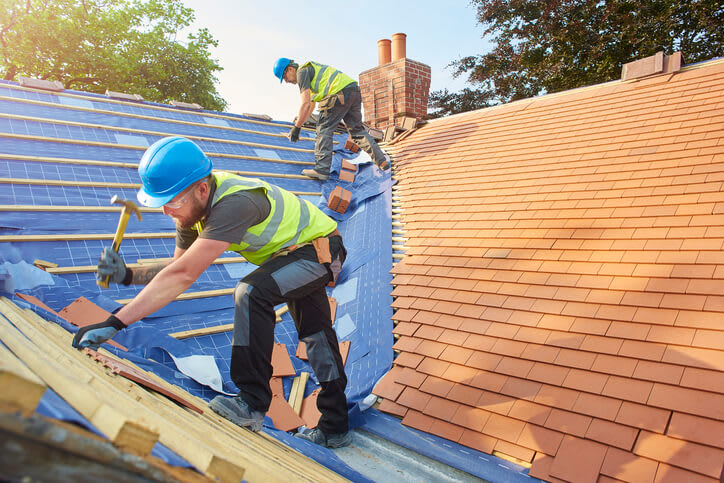 Roofers at work on a home roof