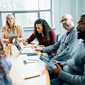 Group At A Meeting Table