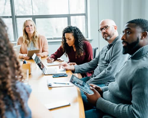 Group At A Meeting Table