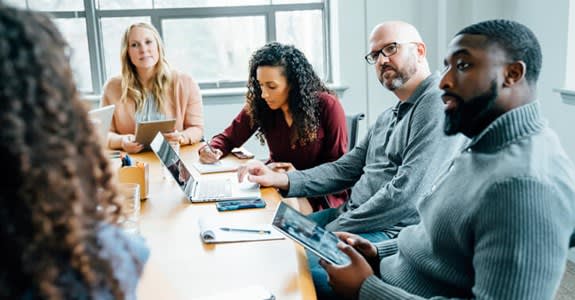 Group At A Meeting Table