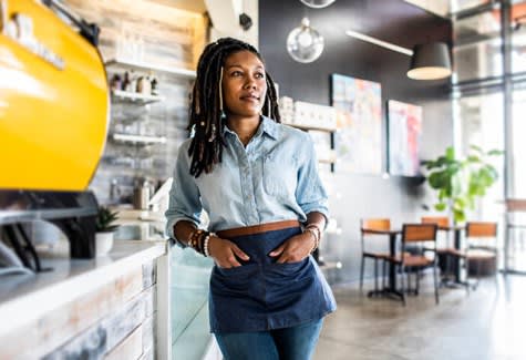 Barista Posing At Coffee Counter