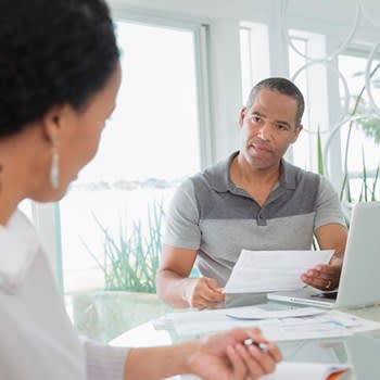 Serious couple reviewing medical bills