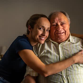 Smiling man and his adult daughter