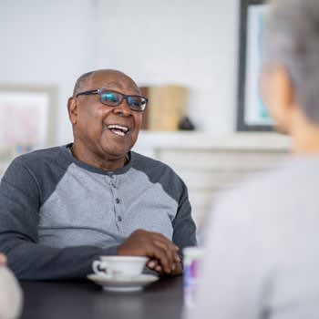 Man Having Tea With Friends