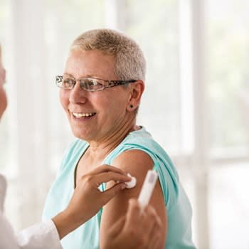 Woman gets prepared for vaccination
