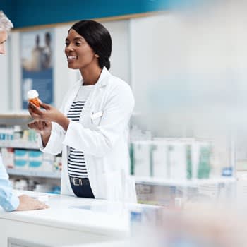 Pharmacist helps her patient in the pharmacy