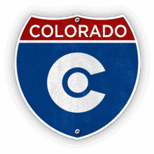 Road sign with Colorado text and state outline.