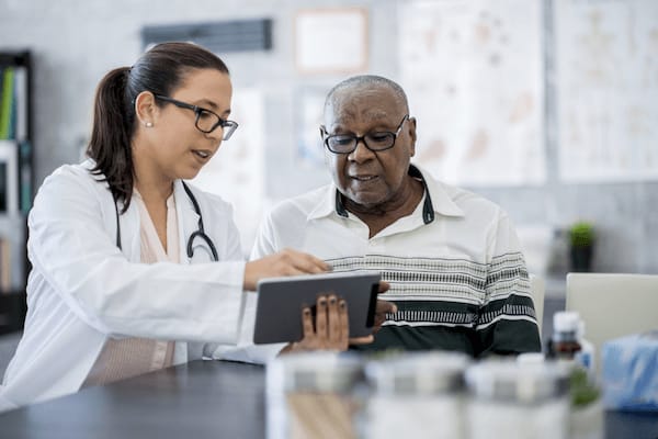 Doctor reviews information with her patient