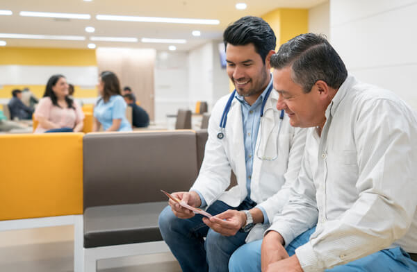 Doctor and patient sit down and review information