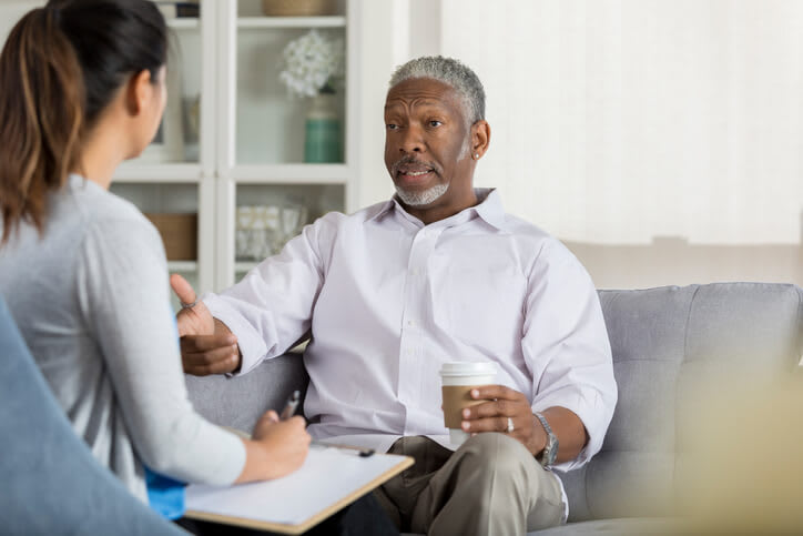 A man speaks with his mental health care therapist