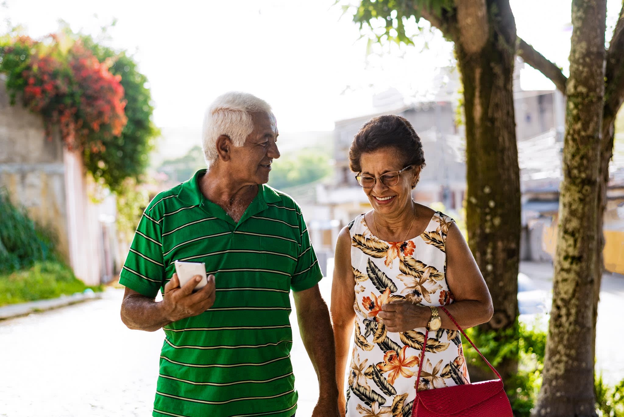 Elderly Couple Walking Smiling