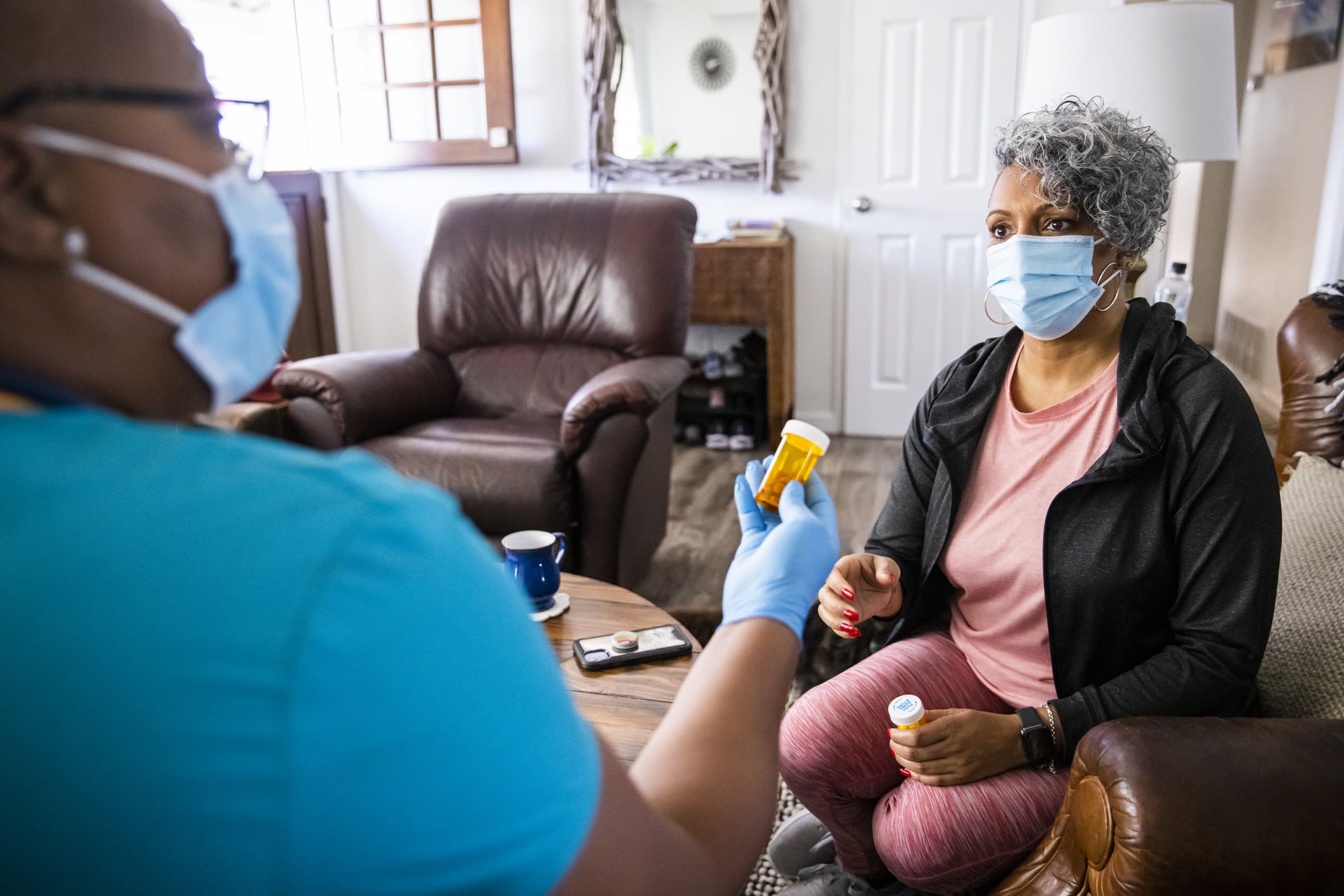 Senior Black Woman And Nurse Home Healthcare Visit