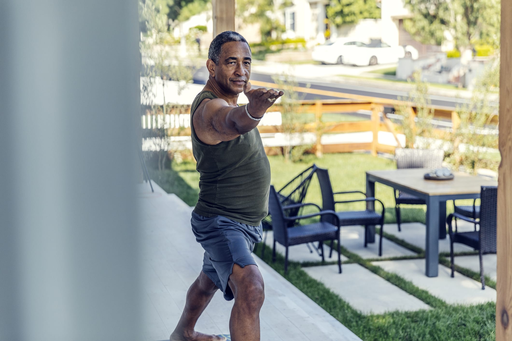 Mature Man Practicing Yoga Outdoors