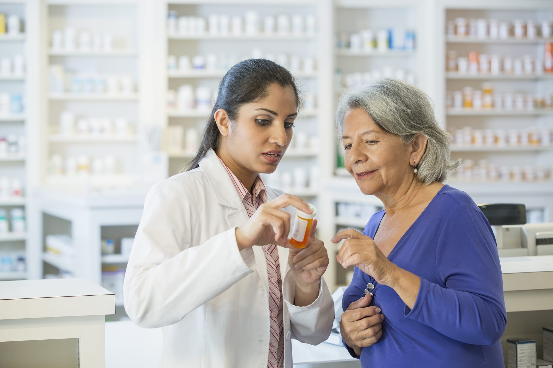 Pharmacist Talking To Customer