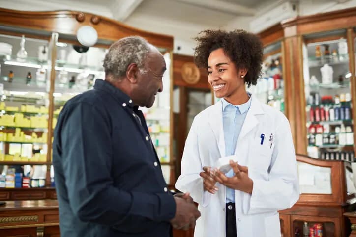 Pharmacist talking to her patient