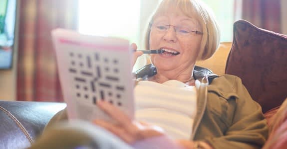Woman doing crossword puzzle