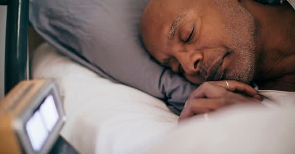 Man sleeps soundly in bed