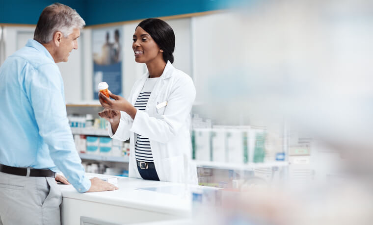 Pharmacist helps her patient in the pharmacy