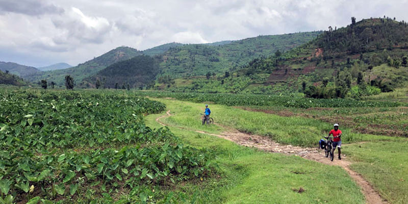 cheap flights - cheap travel destinations - Tourists in Rwanda riding down the congo nile trail