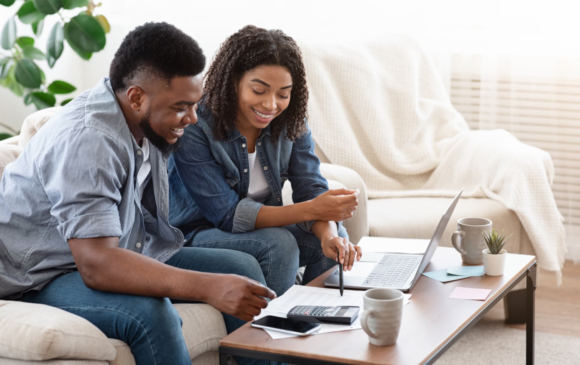 Couples making a budget for their upcoming trip - A GUIDE TO PLANNING A STRESS-FREE VACATION - travelbeta blog