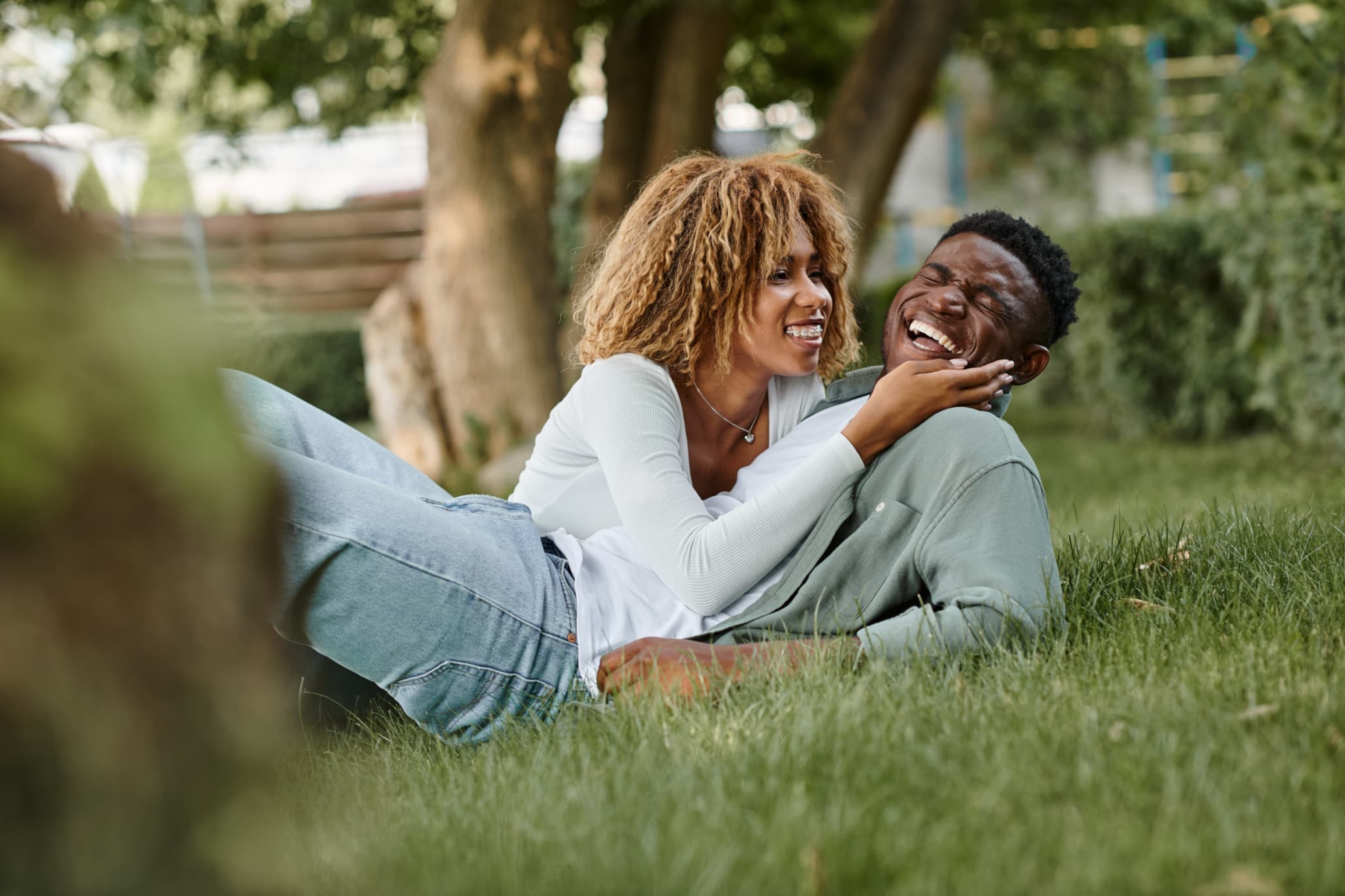 Couples relaxing in the garden, sharing laughters - A GUIDE TO PLANNING A STRESS-FREE VACATION - travelbeta blog