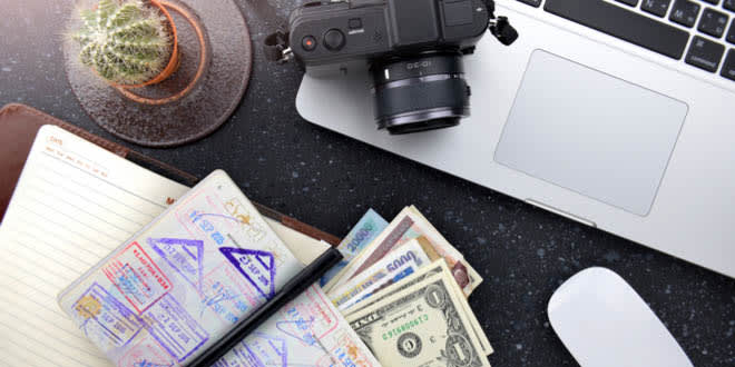 Passport, money and Vietnam visa on a table. Getting ready for a trip to SouthEast Asia.