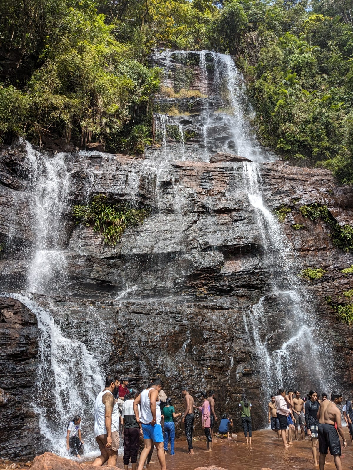 The multi-tiered Jhari Falls cascading over dark rock in Chikmagalur