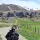 Thumbnail: A person in a wheelchair going down a path in the hills