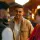 Thumbnail: People socialising and shaking hands in a bar