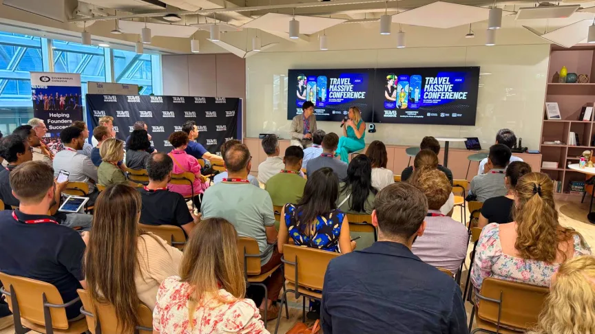 Matthew Gardiner interviewing Sally Bunnell in front of a crowd of people at the Stripe Innovation Evening in London