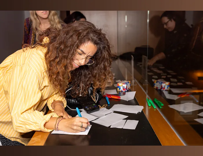 A woman checking in at the Toronto Travel Massive event