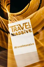 A Travel Massive flyer with artistic yellow light behind