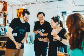 Jared Lerner and some participants at the meetup talking at the event